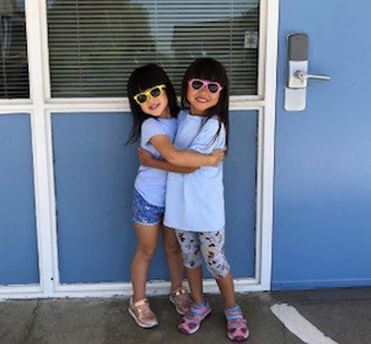 two girls wearing sunglasses